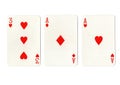 Vintage playing cards showing a pair of aces and a three. Royalty Free Stock Photo