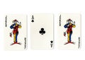 Vintage playing cards showing a pair of pair of jokers and an ace.