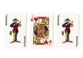 Vintage playing cards showing a pair of jokers and a jack.