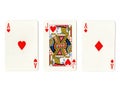 Vintage playing cards showing a pair of pair of jokers and a jack.