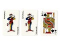 Vintage playing cards showing a pair of jokers and a jack.
