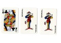 Vintage playing cards showing a pair of pair of jokers and a queen. Royalty Free Stock Photo