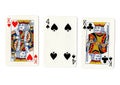 Vintage playing cards showing a pair of kings and a four. Royalty Free Stock Photo