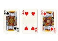 Vintage playing cards showing a pair of kings and a four. Royalty Free Stock Photo