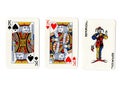 Vintage playing cards showing a pair of kings and a joker. Royalty Free Stock Photo