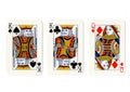 Vintage playing cards showing a pair of pair of kings and a queen. Royalty Free Stock Photo