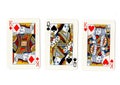 Vintage playing cards showing a pair of pair of kings and a queen. Royalty Free Stock Photo