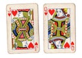 Vintage playing cards showing a queen and jack of hearts. Royalty Free Stock Photo