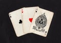 Vintage playing cards showing three aces. Royalty Free Stock Photo