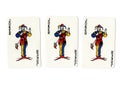 Vintage playing cards showing three jokers.