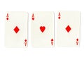 Vintage playing cards showing three red aces. Royalty Free Stock Photo