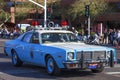 Vintage Plymouth police car in the Scottsdale Parada Del Sol which is advertised as the worldÃ¢â¬â¢s largest horse drawn parade