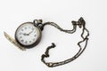 Vintage pocket watch on a chain on a white background Royalty Free Stock Photo