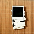 Vintage Polaroids Frames Thrown on Bamboo Royalty Free Stock Photo
