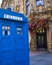Vintage Police Box and the Ivy Resturant in Glasgow, Scotland Royalty Free Stock Photo