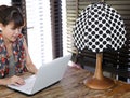 Vintage polka dot lamp with intentionally blurred working woman