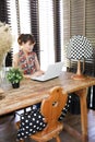 Vintage polka dot lamp with intentionally blurred working woman