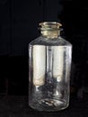 Vintage pontil type bottle on dark backdrop studio shot