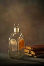 Vintage pontil type bottle on rustic backdrop studio shot Lokgram