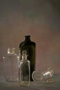 Vintage pontil type bottles on rustic backdrop studio shot Lokgram Royalty Free Stock Photo