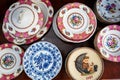 Vintage porcelain dishware plates and bowl displayed in an antique store