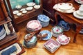 Vintage porcelain dishware and teacups displayed in an antique store in Ankara, Turkey