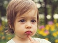 Vintage portrait of Cute kid thinking at the park