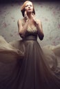 Vintage portrait of glamorous red-haired woman in great dress Royalty Free Stock Photo