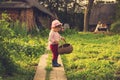 Vintage portrait of happy Cute kid with big basket having fun at countryside Royalty Free Stock Photo