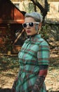 Vintage Portrait of tattooed blonde Woman with Dress and Sunglasses