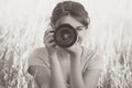 Vintage portrait of a young nature photographer to shoot in the field on photographic equipment Royalty Free Stock Photo