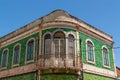 Vintage Portuguese green tiles faÃ§ade of an old house in Lisbon with an old vintage iron balcony. Royalty Free Stock Photo