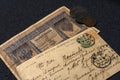 Vintage Postcard, past mail. Handwritten text with the address in Russian. Old banknote 1 ruble. Russia 1910 year