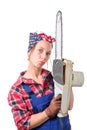 Vintage pretty young woman with a chainsaw
