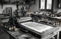 Vintage Printing Press in Artisan Workshop with Tools and Ink Bottles Royalty Free Stock Photo