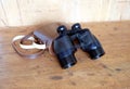 Vintage prism black color binoculars and brown leather case