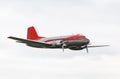 Vintage propeller airplane against cloudy sky Royalty Free Stock Photo