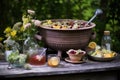 vintage punch bowl set on rustic wooden table in garden Royalty Free Stock Photo