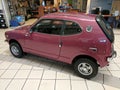 Vintage purple Honda Z600 coupe in mint condition - back drivers side view