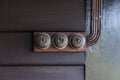 A Vintage put light switch on wooden interior wall Royalty Free Stock Photo