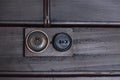 A Vintage put light switch on wooden interior wall