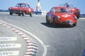 Vintage racecars speed along the track during the Laguna Seca race in California
