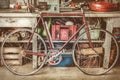Vintage racing bycicle in front of an old work bench with tools Royalty Free Stock Photo