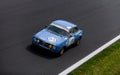 Vintage racing car, classic retro motor sport action, Alfa Romeo Giulia GTAm on asphalt race track Royalty Free Stock Photo