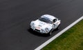 Vintage racing car, classic retro motor sport action, Alpine A110 on asphalt race track