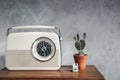 Vintage radio with cactus on the wooden table Royalty Free Stock Photo