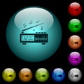 Vintage radio clock with music icons in color illuminated glass buttons Royalty Free Stock Photo