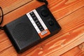 Old radio for listening to radio programs on a wooden background