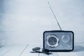 Vintage radio and sunglasses on wooden table Royalty Free Stock Photo