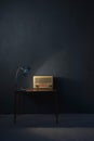 Vintage radio on wooden table lit by desk lamp. Royalty Free Stock Photo